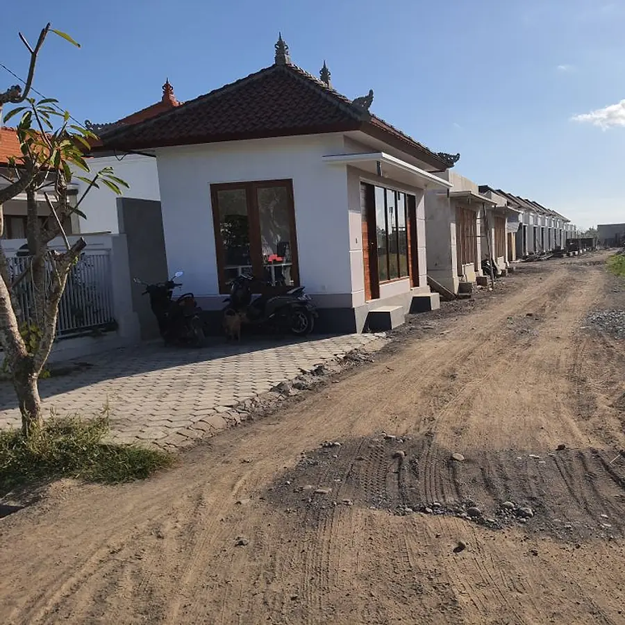 A finished single-storey home at LC Residence with a paved front yard
